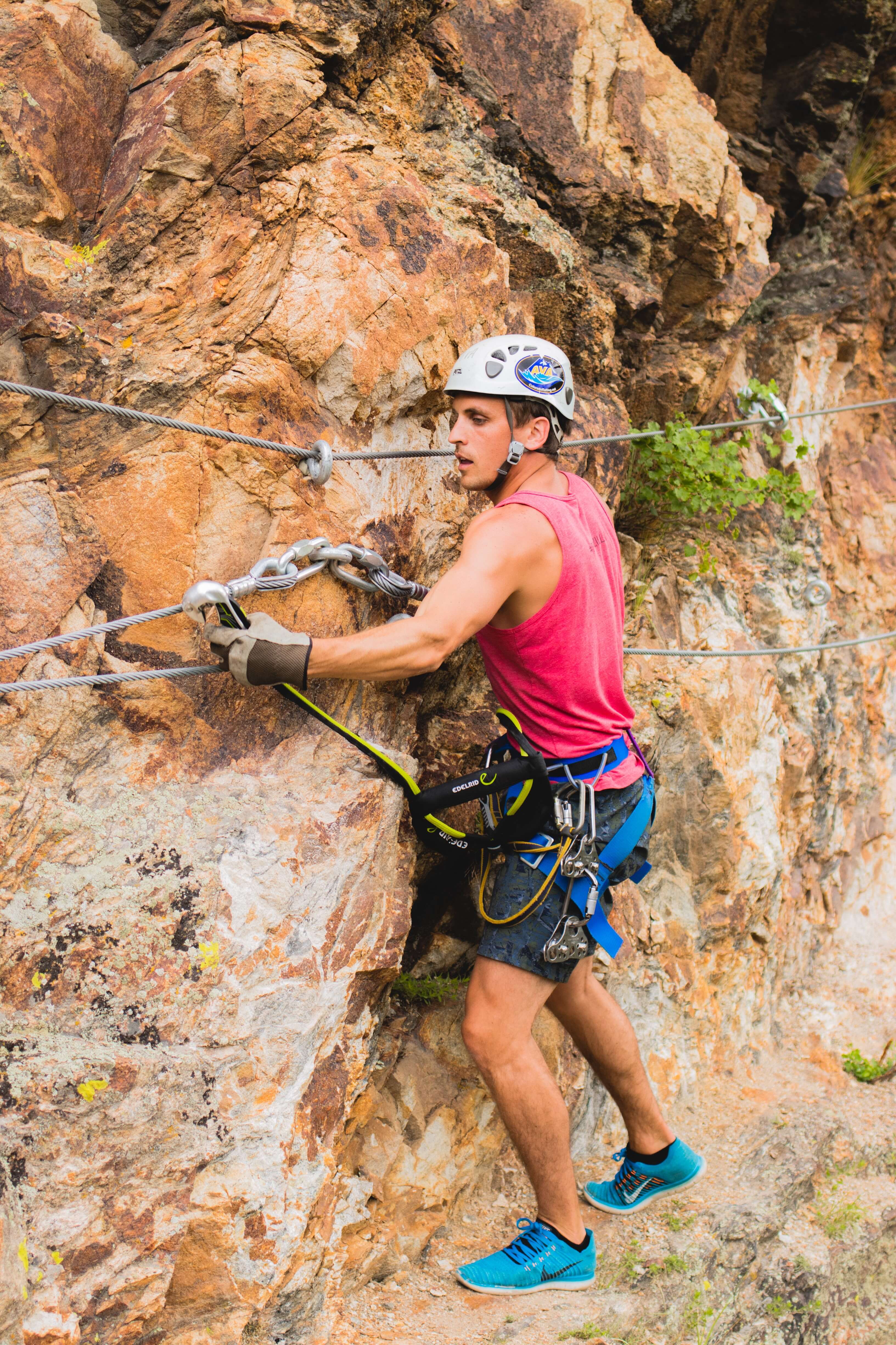 Man hanging off BV Via Ferrata