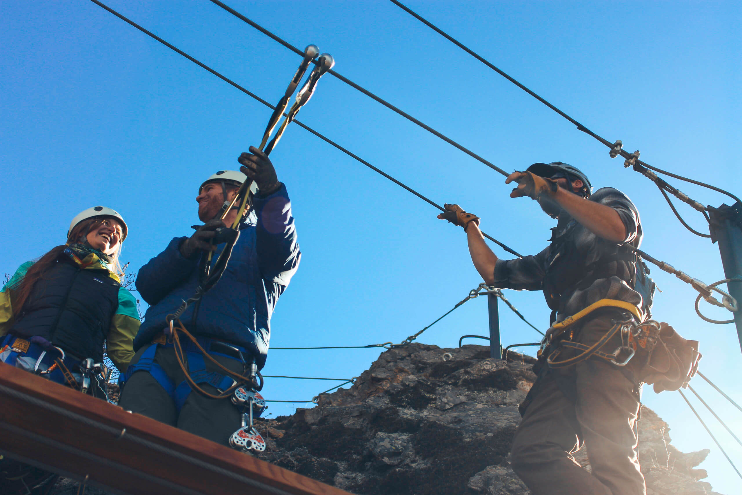 A group of people laughing on the via ferrata course
