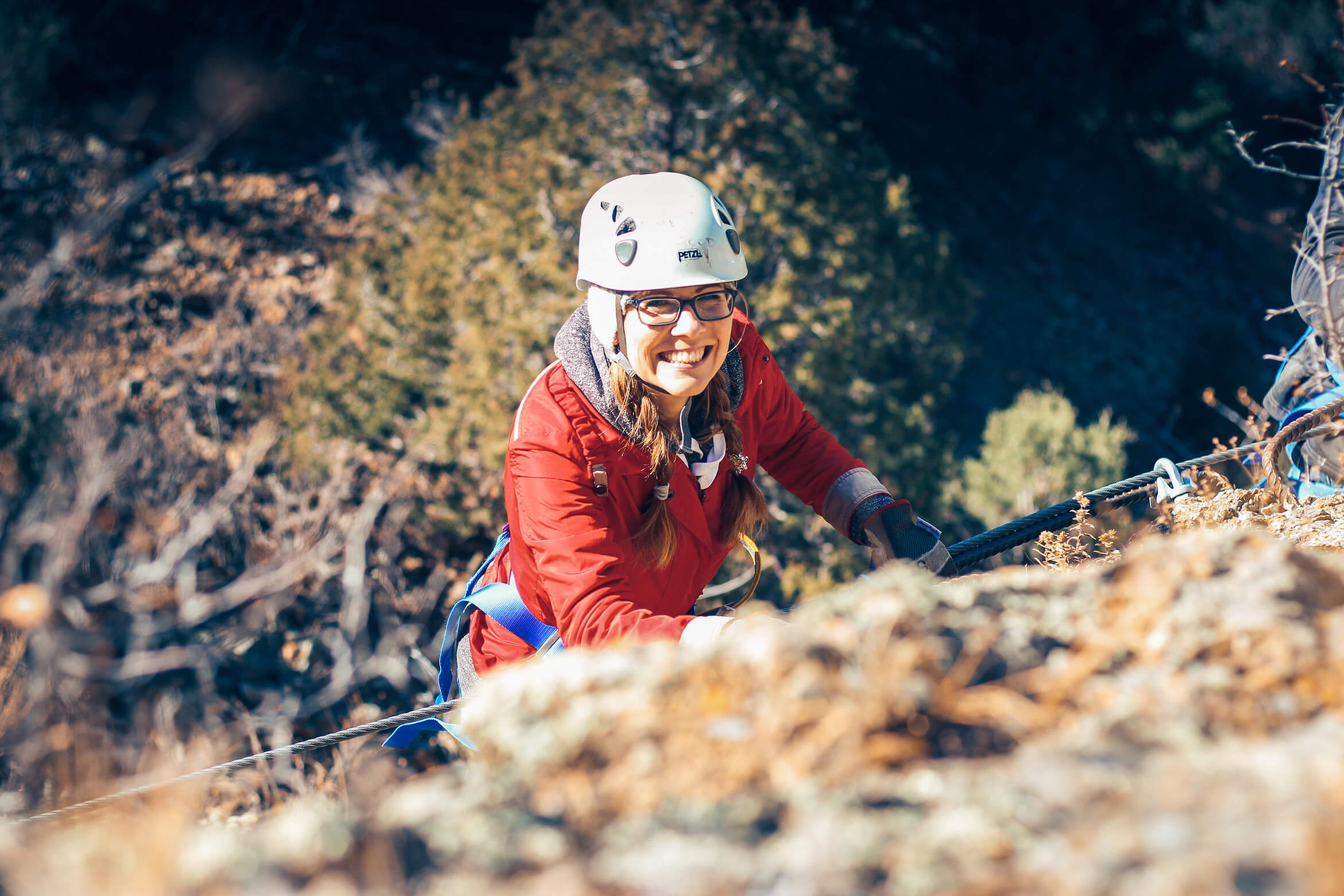 woman smiling on the mount evans via ferrata in colorado